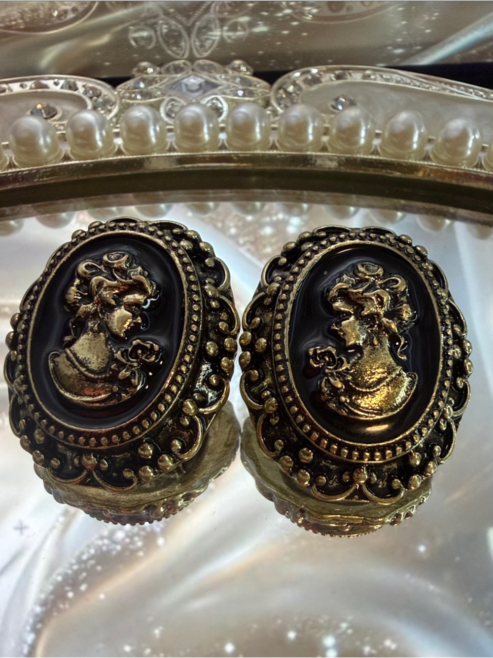 Trifari Black and Gold Cameo Clip-On Earrings